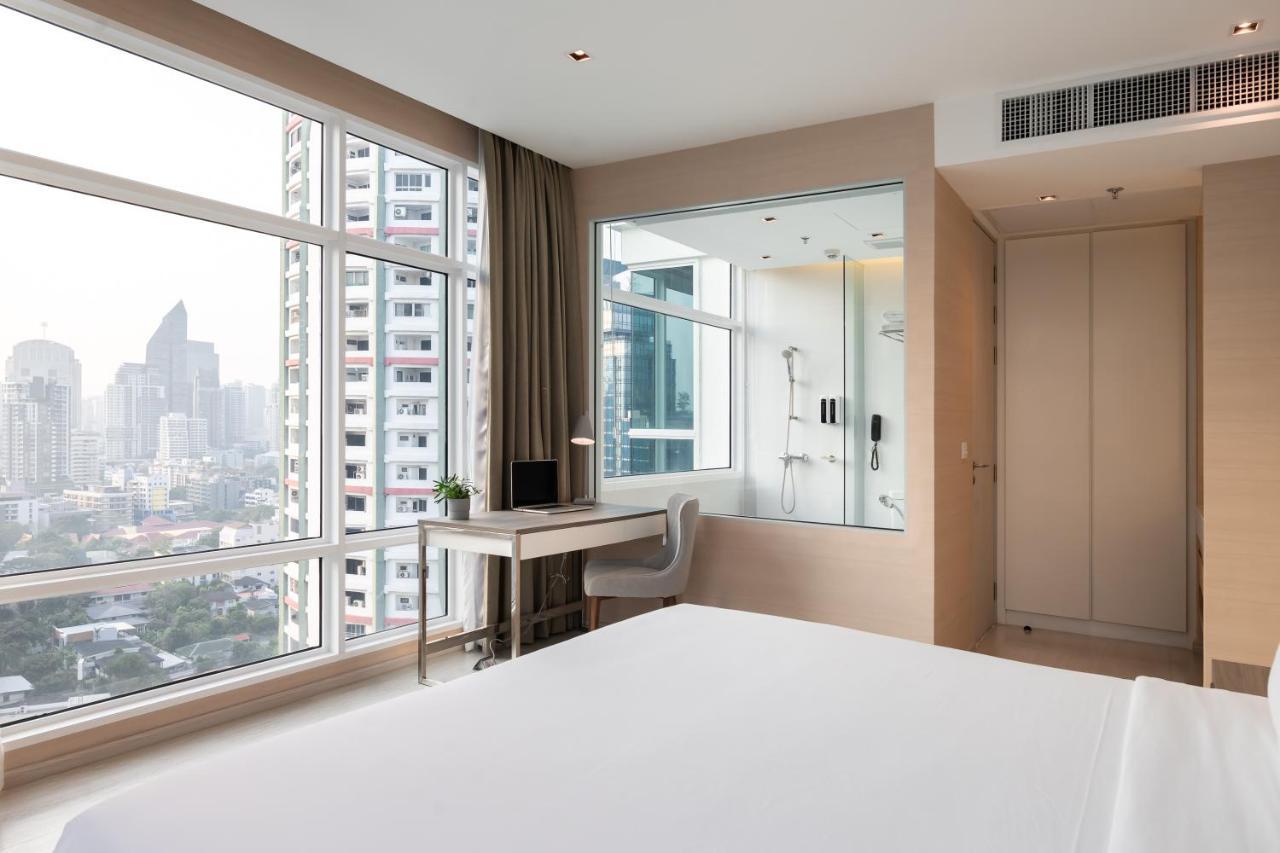 Jasmine 59 Hotel Bangkok Exterior foto A bedroom at the hotel